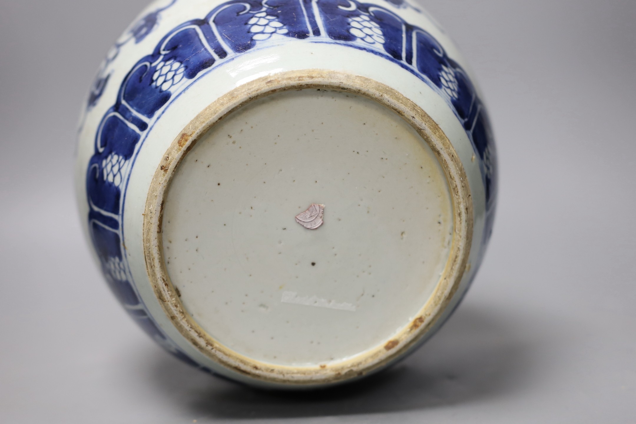 An 18th century Chinese blue and white jar, painted with ‘shou’, flowers and tendrils, 22cm high